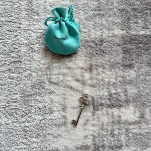 Tiffany & Co. Silver Key Pendant with Blue Pouch